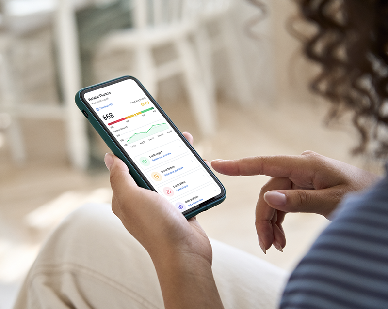 Woman checks her credit score on her phone using Array's My Credit Manager